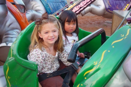 Kasen and Emma Kate riding at the county fair